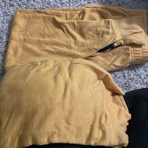 Harry Potter pj set. Yellow with all house logo on pants. Pants run big